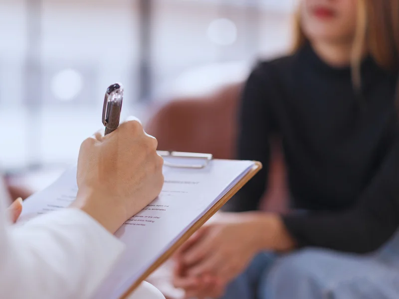 Therapist writing
