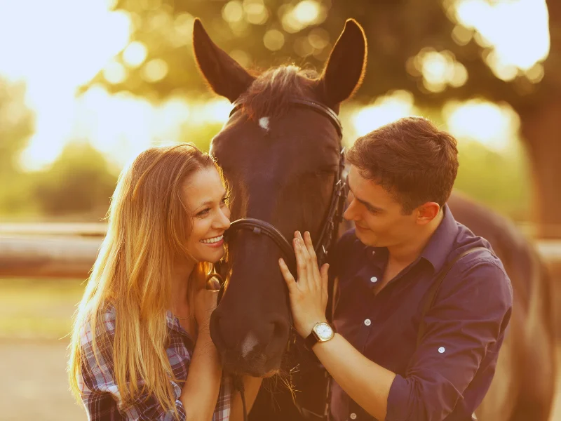 couple happy with horse
